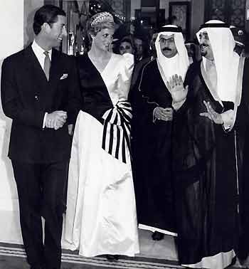 The Prince and Princess of Wales walk with Saudi Arabia's King Fahd (R) at the Al Yamamah Palace in Riyadh in this November 17, 1986 file photo.