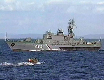 A video grab shows a Russian vessel involved in rescue work in the Pacific Ocean August 6, 2005. The Russian navy, backed by a British deep-sea rescue machine, struggled on Sunday to free a trapped mini-submarine from the Pacific depths and save its crew before their air supply ran out. Naval officials warned they may only have Sunday left to rescue the seven men stuck on board the AS-28, which is snarled up in heavy metal debris 190 metres (600 feet) below the surface, because of dwindling oxygen.
