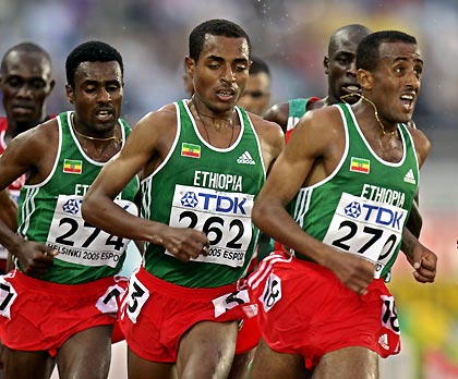 L to R) Ethiopia's Sileshi Sihine, Kenenisa Bekele and Abebe Dinkesa compete during the men's 10,000 metres finals at the world athletics championships in Helsinki August 8, 2005. Bekele won the gold medal in a time of 27 minutes 8.33 seconds, while Sihine took silver.