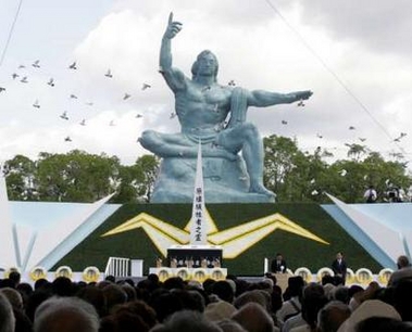 Doves flutter around the Peace Statue in Nagasaki's Peace Park in Nagasaki, western Japan, during a ceremony commemorating the 60th anniversary of the city's atomic bomb blast August 9, 2005.