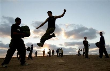 Israeli soldiers practice in a routine exercise near the southern Israeli kibbutz of Mefalsim close to the Gaza Strip , Wednesday Aug. 10, 2005.