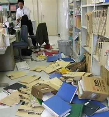 Documents are scattered on the floor of the Kyodo News Agency's bureau in Sendai in Miyagi Prefecture Tuesday, Aug. 16, 2005 shortly after a strong earthquake hit northern Japan, shaking buildings as far away as Tokyo. [AP]