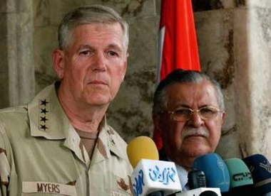Iraqi President Jalal Talabani (R) attends a news conference with U.S. Joint Chiefs of Staff Chairman General Richard Myers in the heavily fortified Green Zone area in Baghdad August 17, 2005. General Myers expressed his optimism that the draft of Iraq's new constitution will be finished by the August 22 deadline.