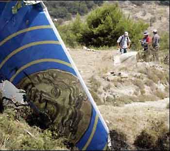 Investigators work at the crash site of the Helios plane on the Grammmatiko hills near Athens. 