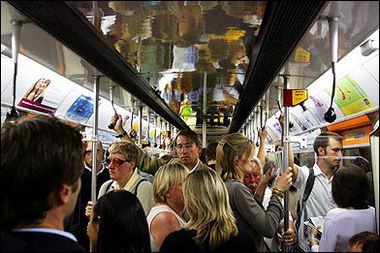 People on the London Underground during evening rush hour in July 2005.