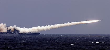 A Chinese warship fires missiles during a China-Russia joint military exercise off China's Shandong Peninsula August 23, 2005. 