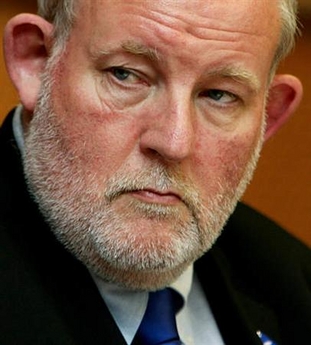 Britain's Home Secretary Charles Clarke looks on before addressing the European Parliament justice and home affairs committee in Brussels July 13, 2005. Britain will on Wednesday unveil measures to rid the country of radical clerics who could inspire bombers like those who attacked London last month as part of a broad crackdown on Islamist preachers.