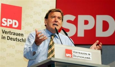 German Chancellor Gerhard Schroeder speaks in Magdeburg, Saxony-Anhalt, Monday, Aug. 22, 2005, during his election campaign. Slogan reads: Confidence in Germany.