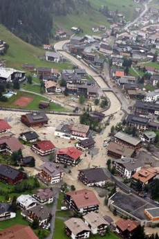 An aerial view of the flooded Austrian ski resort of Lech am Arlberg, Austria August 23, 2005. Lakes and rivers burst their banks after days of fierce downpours across Switzerland, Austria and Germany, cutting off roads, power and communications from hundreds of communities. In Austria, the death toll rose to three on Wednesday and a fourth person was missing, feared drowned, police said. In Austria, an emergency cabinet meeting pledged swift aid to homeowners and farmers while flood waters receded after the rain petered out in the hardest hit provinces of Vorarlberg and Tyrol, bordering Switzerland and Bavaria. Picture taken August 23, 2005. REUTERS