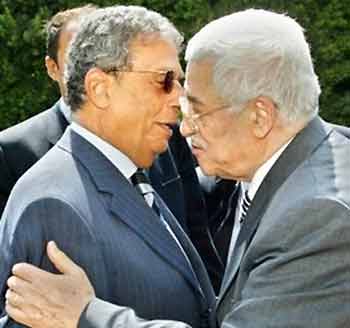 Palestinian leader Mahmoud Abbas, right, hugs Amr Moussa, Secretary General of the Arab league, following their meeting in Cairo Wednesday,Aug. 24, 2005. 
