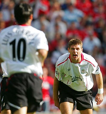 Liverpool's captain Steven Gerrard (R) shouts to his team mate Luis Garcia during their English Premier League soccer match against Middlesbrough at the Riverside Stadium in Middlesbrough, August 13, 2005.