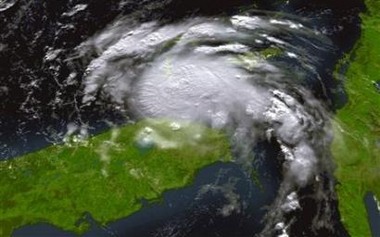 National Oceanic and Atmospheric Administration satellite image of Tropical Storm Katrina taken at 9:15 a.m. EDT August 25, 2005, as the outer bands of the storm begin lashing the east coast of Florida.
