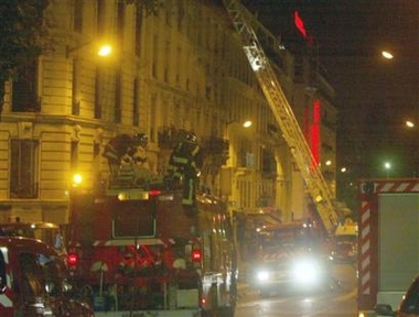 Fire trucks are lined-up in front of an apartment building in Paris, Friday Aug. 26, 2005. 