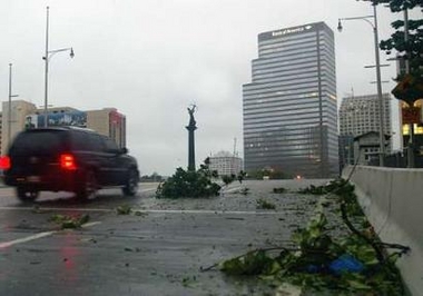 A car crosses a bridge during the tropical storm Katrina after its pass by Miami, August 25, 2005.