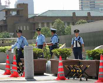 Japanese police guard the official residence of Japanese Prime Minister Junichiro Koizumi in Tokyo after a suicide attempt by a woman August 30, 2005. 