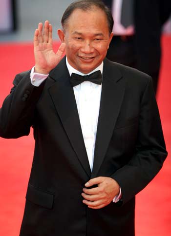 Chinese director John Woo arrives at the Cinema Palace in Venice for the premiere of Chinese director Tsui Hark's movie "Seven Swords" August 31, 2005. [Reuters]