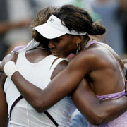 venus williams hugs sister serena after a US Open 4th round match in which venus advanced to quaterfinals.