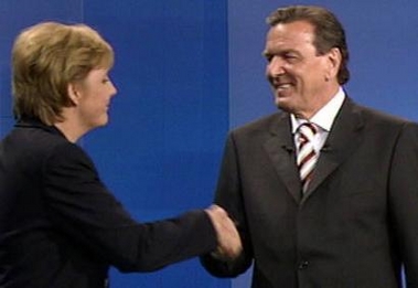 The handout video grab from RTL television shows German Chancellor Gerhard Schroeder (R) and Christian Democratic opposition leader Angela Merkel shaking hands at the end of their debate in a television studio outside Berlin September 4, 2005. REUTERS