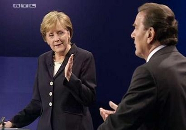 The handout video grab from RTL television shows German Chancellor Gerhard Schroeder (R) and Christian Democratic opposition leader Angela Merkel as they debate in a television studio outside Berlin September 4, 2005. 