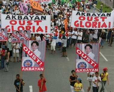 Protesters march towards the Philippine Congress at suburban Quezon city, north of Manila, Tuesday, Sept. 6, 2005 to call for the ouster of Philippine President Gloria Macapagal Arroyo as legislators debate the impeachment complaints against her. 