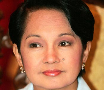 Philippine President Gloria Macapagal Arroyo presides over a national security council meeting with her cabinet in Manila's Malacanang presidential palace August 16, 2005. [Reuters/file]