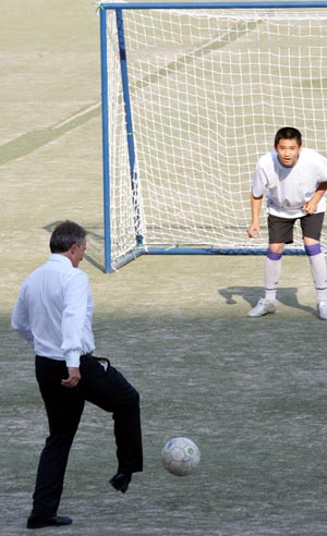 Britain's Prime Minister Tony Blair joins in a football training session at Yue Tan Stadium, Beijing, China, Tuesday Sept. 6, 2005. The Prime Minister is in China for two days for the EU/China Summit meeting.