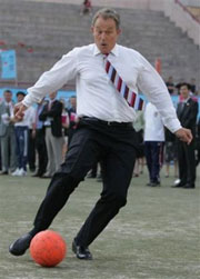 Britain's Prime Minister Tony Blair joins in a football training session at Yue Tan Stadium, Beijing, China, Tuesday Sept. 6, 2005.