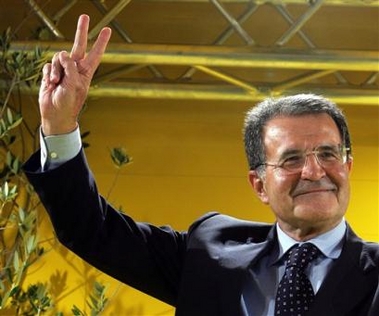 Union center-left coalition leader Romano Prodi flashes the victory sign on the stage of the truc in which he's campaigning travelling throughout Italy ahead of the primary election, in Rome, Wednesday, Sept. 7, 2005. 