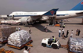 Relief materials for the victims of Hurricane Katrina from the Chinese government are put into an aeroplane in Beijing airport September 7, 2005. China has offered $5 million in aid for victims and Beijing said the government was prepared to send rescue workers including medical experts if needed. 