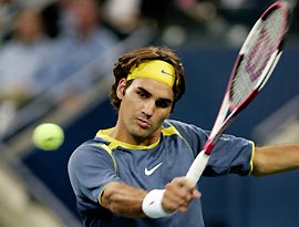Roger Federer of Switzerland hits a return to David Nalbandian of Argentina in their quarterfinal match at the U.S. Open tennis tournament in Flushing Meadows, New York, September 8, 2005.