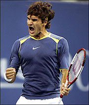 Roger Federer of Switzerland screams after winning the third set during the US Open final against Andre Agassi of the US at the USTA National Tennis Center in Flushing Meadows, New York. Federer won 6-3, 2-6, 7-6 (7/1), 6-1.