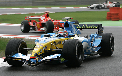 Renault Formula One driver Fernando Alonso of Spain (front) drives in front of Ferrari's Michael Schumacher of Germany during the Belgian Grand Prix at Spa-Francorchamps race track in Francorchamps September 11, 2005.