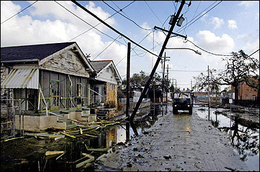 US President George W. Bush, Mayor Ray Nagin, Lousiana Governor Blanco and Vice Admiral Thad Allen tour through an area of New Orleans, Louisiana, standing in the back of a military truck, where the flood waters recently receeded.