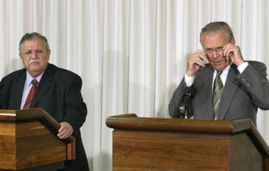 U.S. Secretary of Defense Donald Rumsfeld (R) and Iraqi President Jalal Talabani speak at a joint news conference after their meeting at the Pentagon in Washington, September 9, 2005. 