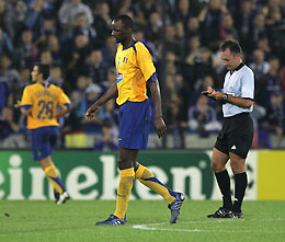 Juventus' Patrick Viera (C) leaves the pitch after getting a red card from referee Luis Medina Cantalejo during the Champions League Group A soccer match against Club Bruges at the Jan Breydel stadium in Bruges September 14, 2005. Juventus won 2-1.