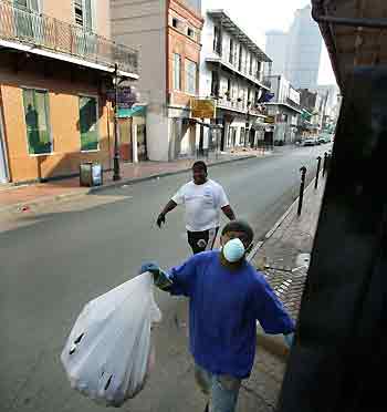 A worker cleans a street of the French Quarter in New Orleans September 15, 2005. New Orleans took a big step towards recovery from Hurricane Katrina on Thursday, when its mayor declared parts of the city would reopen at the weekend, as U.S. President George W. Bush prepared to announce a major rebuilding operation for the devastated Gulf region. [Reuters]