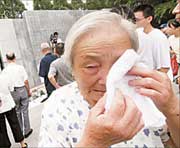 Yang Cuiying, a survivor of the Nanjing Massacre, cries as she mourns for her relatives killed by Japanese troops in the 1937 massacre. A memorial event was held yesterday at the Memorial Hall of the Victims in Nanjing Massacre by Japanese Invaders, to commemorate the 74th anniversary of the September 18 Incident, which marked the start of the Japanese annexation of Northeast China in 1931. 