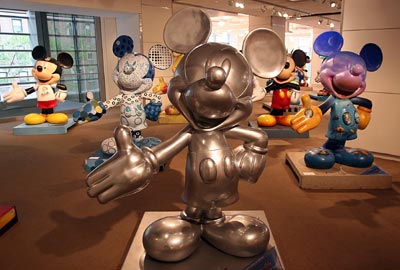 Statues of Mickey Mouse fill a room at Sotheby's in New York City on September 20, 2005. As part of Mickey Mouse's 75th anniversary, 75 statues of the famous mouse were painted and will be auctioned off on September 27 for different charities.
