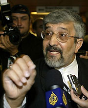 Iran's Ambassador to the International Atomic Energy Agency (IAEA) Ali Asghar Soltanieh talks to journalists during an IAEA board of governors meeting in Vienna, Austria, September 21, 2005. 