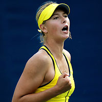 Maria Sharapova of Russia celebrates after scoring a point against Israel's Shahar Peer during their women's singles match at the China Open tennis tournament in Beijing September 22, 2005. 