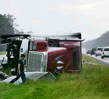 A truck lies on its side on I-10 highway in Orange, Texas in the aftermath of Hurricane Rita September 24, 2005.