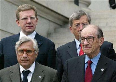 The Bank of Italy's Antonio Fazio (Bottom L) with U.S. Federal Reserve Chairman Alan Greenspan and Russian Finance Minister Aleksey Kudrin (Top L) with Jean-Claude Juncker, prime minister of Luxembourg, pose for a group photo outside the Treasury Department in Washington after a G7 finance ministers meeting September 23, 2005. 