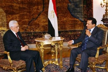 In this photograph released by the Palestinian Authority, Palestinian leader Mahmoud Abbas, left, meets with Egyptian President Hosni Mubarak in Cairo, Egypt, Wednesday, Sept. 28, 2005, to discuss the critical events in Gaza after the Israeli withdrawal and to seek Egypt's good relations with Israel and other parties to ease the situation. (AP