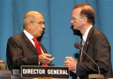 IAEA Director General Mohamed ElBaradei (L) talks to U.S. Ambassador Gregory Schulte before the 49th regular session of the IAEA General Conference in Vienna September 26, 2005. 