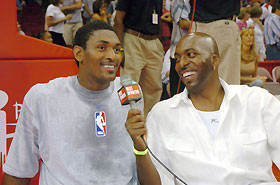 Ron Artest of the Indiana Pacers (L) talks to announcer John Salley before the NBA Hurricane Relief Fund Charity basketball game in Houston September 11, 2005.