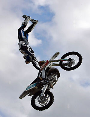 England's Chris Rock performs a stunt in the air with his motorcycle during a freestyle motorcross demonstration in Rotterdam, the Netherlands, October 9, 2005.