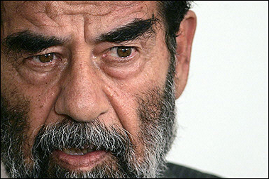 A top British lawyer may defend Saddam Hussein, pictured July 2004, whose trial is due to start next Wednesday, a legal clerk said, as another member of the defence team claimed that Iraq's fallen president was in 'high spirits'. [AFP/file]