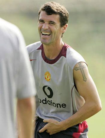 Ireland skipper Roy Keane, a devotional Catholic, has a cross on left arm.