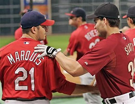 Houston Astros Luke Scott, right, shakes hands with St. Louis Cardinals' relief pitcher Jason Marquis during the teams' warm-ups before Game 5 of their National League Championship Series in Houston, Monday, Oct. 17, 2005.
