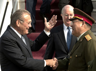 eUS Secretary 
 of Defense Donald Rumsfeld is greeted by General Xiong Guongki on his arrival in Beijing n REUTERS s X80003 x ?.S. Secretary of Defense Donald Rumsfeld (L) is greeted by General Xiong Guongki on his arrival in Beijing October 18, 2005. Rumsfeld is in Beijing for a three-day visit to try to boost exchanges with the Chinese military and discuss regional security worries over North Korea. Rumsfeld, who will also visit South Korea, Mongolia, Kazakhstan and Lithuania, is making his first trip to China since taking office in 2001 amid growing U.S. concern about rising Chinese military spending. 